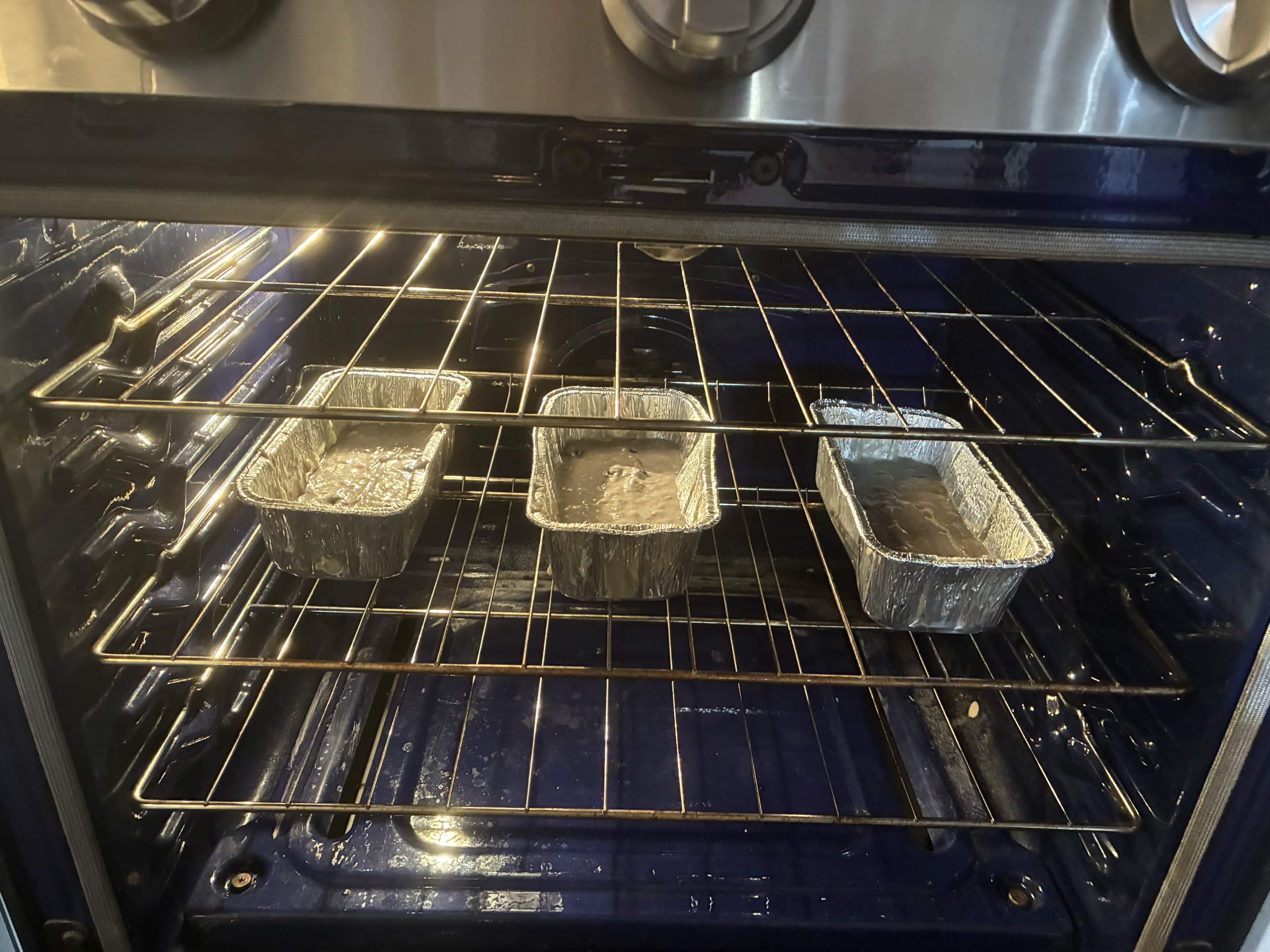 Loaf pans going into the oven.
